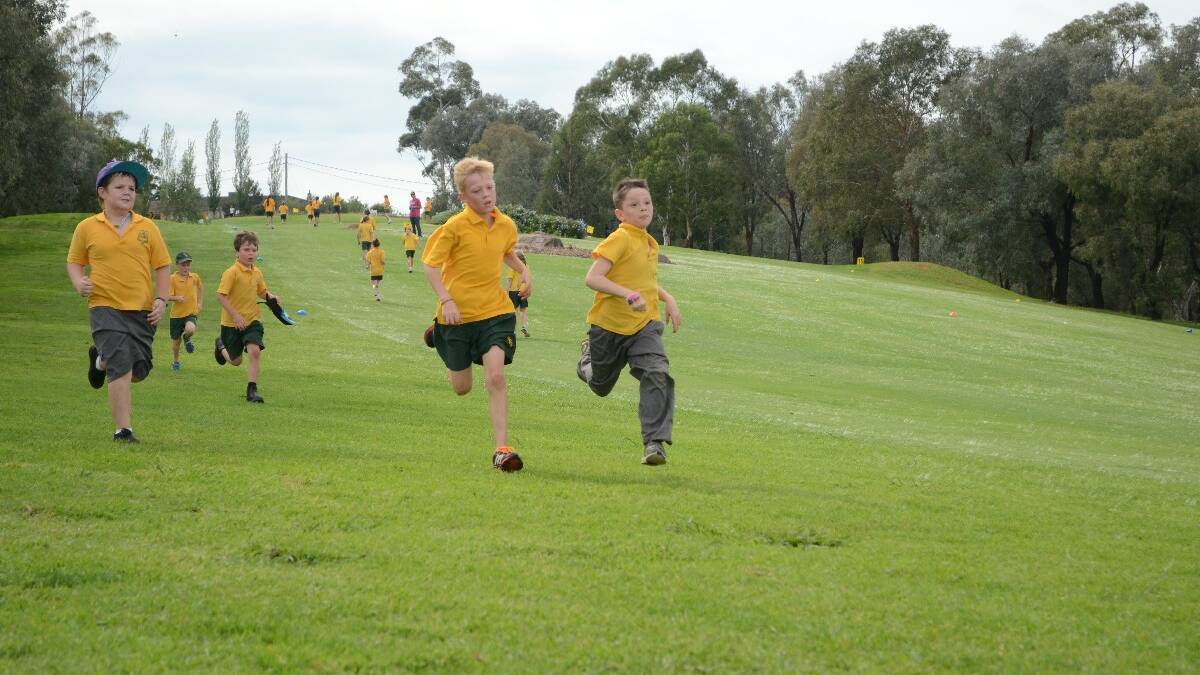 FAST! Year 3 student Brock Lindsay and Year 4 Aiden Hines raced each other on the final stretch of the Young Public School cross country event at the Young Golf Club on Thursday. 