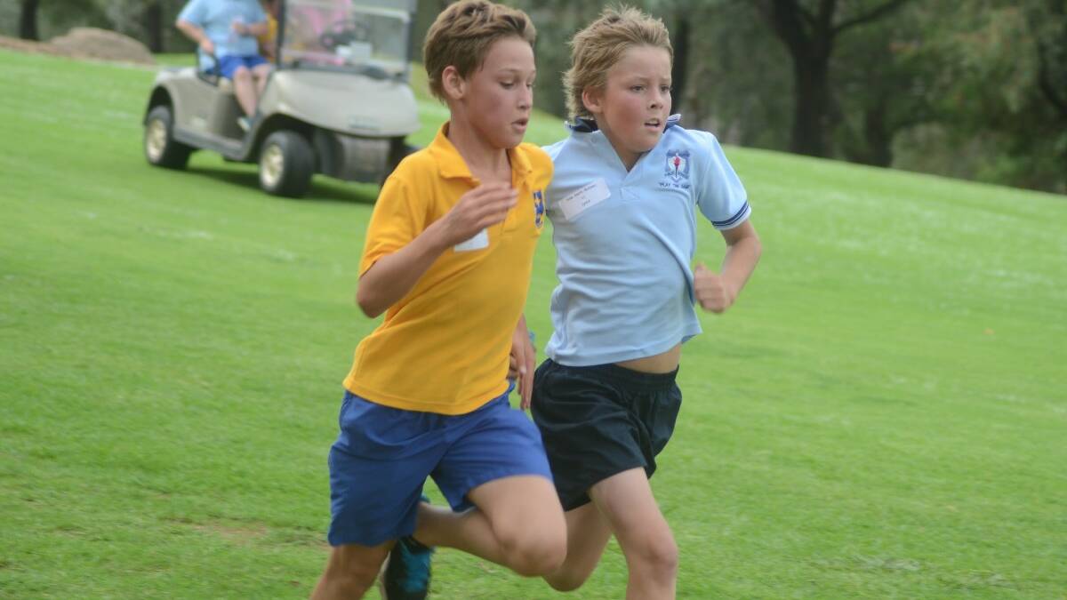 SPRINT: Students from each school entered into friendly rivalry sprints at the finish line, as did this pair (right) Max Kirkwood from St Mary’s and Duke Smith-Maloney from Young North.