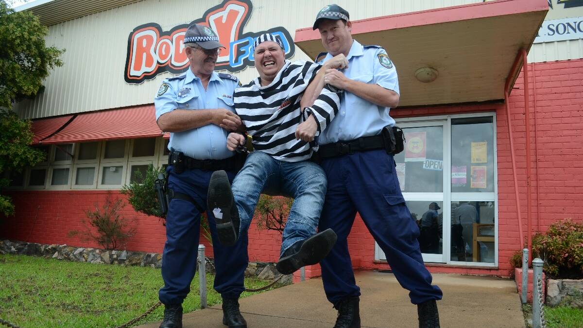 To the lock-up for Wes: The scenes outside 2LF and Roccy FM yesterday at noon were not pretty as Sergeant John Waples and Senior Constable Brendan Clark arrived to take local radio DJ Wes Heather into custody. But it was all in good fun, raising money for the Young Police Citizens Youth Club for their annual Time4Kids fundraiser.