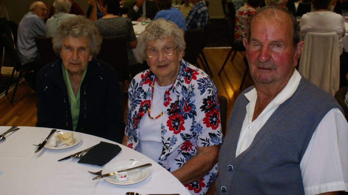 FAMILY: Sisters Annie Trudgett and June Woods dine with brother Gordon Jarrott at the  Seniors Week lunch at the Young Services Club.