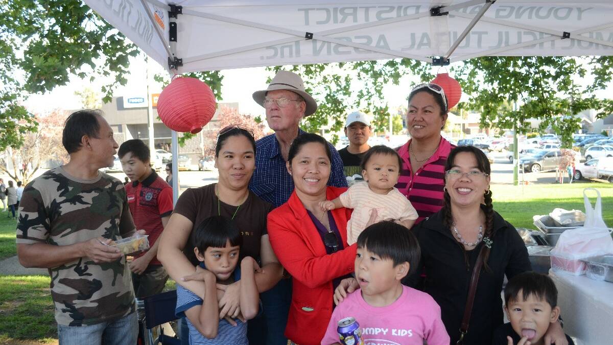 MULTICULTURAL SOCIETY: Back: Michael Mercer and Joy Carter-Karajcic; front, from left to right, Rey Surilla, Patrick Le, Roselyn Surilla, Nicholas Surilla, (blue stripe), Wilma Obrien, Ethan Surilla (baby), Derwin Le (pink shirt) Vanessa Le, Roderick Le.