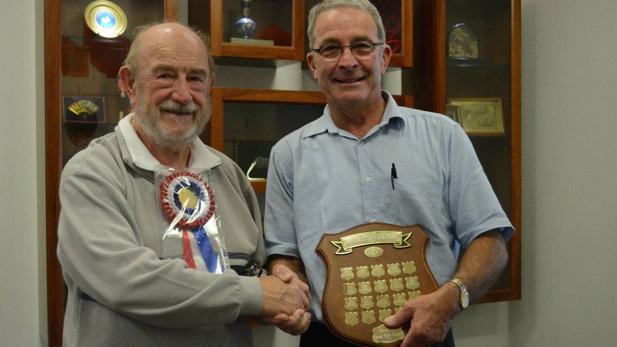 Rewarded for years of service: Michael Cummings was yesterday named this year’s male winner of Senior of the Year. He is pictured receiving his award from Mayor Stuart Freudenstein.
