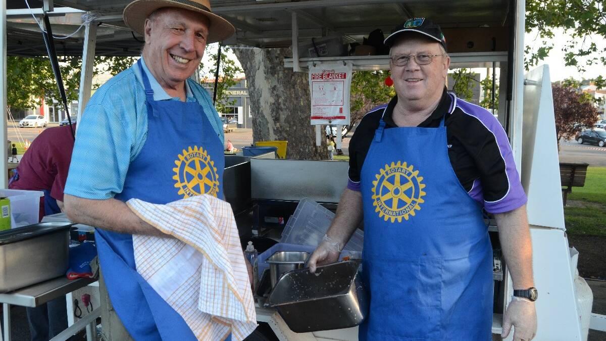 DOMESTIC DUTIES: Young Rotary’s Cliff Sheridan and Ted Loader cleaning up after a big day at the festival. 