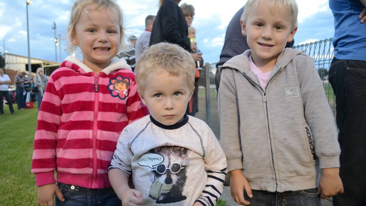 PEEK-A-BOO! It was a family affair at the Carnival of Cups meeting at Young Showground on Saturday night. Enjoying all the fun entertainment were Isabella Webb (4), Jayden Duggan (3) and Harrison Webb (4).