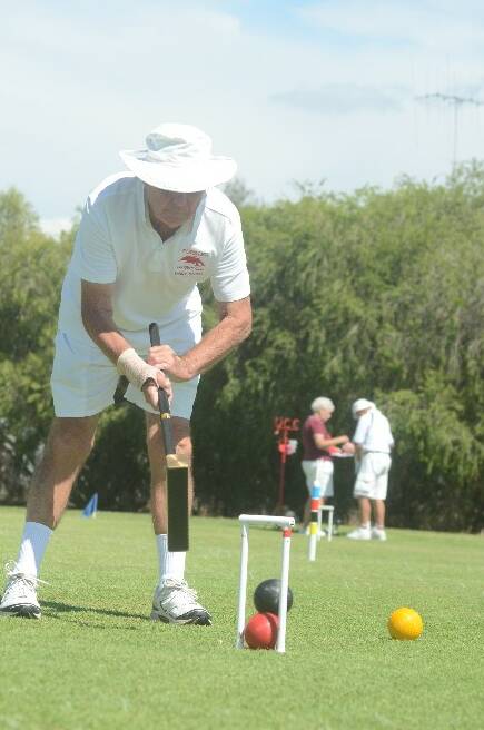 TOP FORM: The Young Croquet Club had a good roll up of out-of-town players for their annual autumn croquet carnival. Player Sandy Coults from Forster was in top form on Friday. 