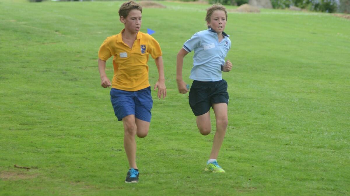 SPRINT: Students from each school entered into friendly rivalry sprints at the finish line, as did this pair (right) Max Kirkwood from St Mary’s and Duke Smith-Maloney from Young North.