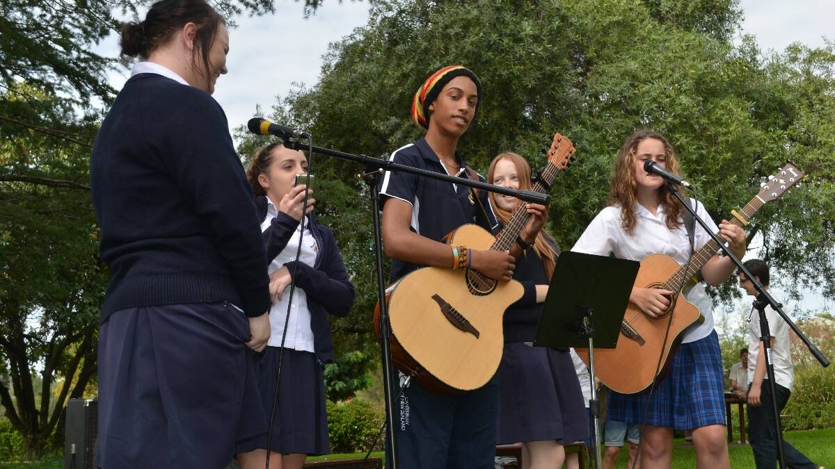 ENTERTAINMENT: Jess Barton and Vanessa Mitchell from Hennessy Catholic College joined Young High student Will Ozurumba, Holly Cormack (Hennessy) and Lucy Caldow (Young High) in entertaining the crowd.	
