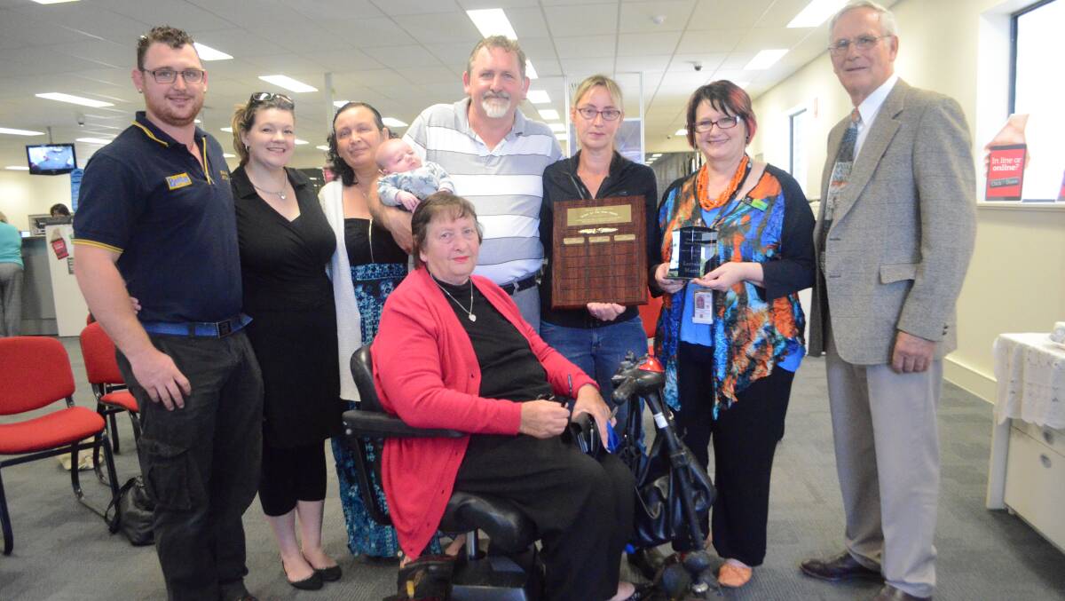 RECOGNITION: 2014 Young Carers Award recipient Lorraine Martin (second from right) with her family Kyle and Sharna Martin, Lyn Faulkner, Alan Martin holding Nate and Phyllis Summerfield, Department of Human Services Young manager Debbie Longhurst and mayor John Walker.	