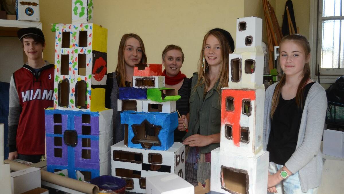 Building a holiday project: A Fantastic Planet workshop is what was on the agenda at the Southern Cross Cinema during the school holidays. Jasper Kemp-Myers, Emily Smith, Tasmin Coulter, artist Tamsin Kemp, and Bridget Maloney with their mini cities.
