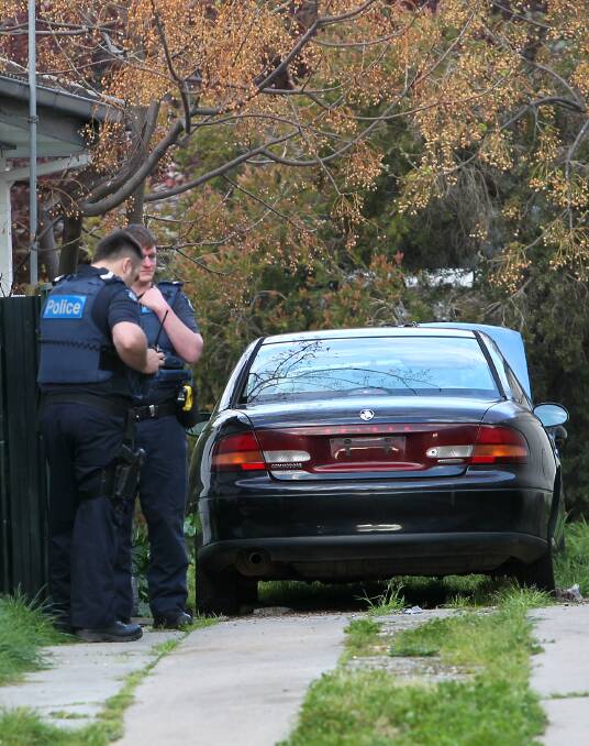 SEIZED: Wodonga officers with a car that hit about 200km/h during a police pursuit at Springhurst on Tuesday afternoon. A range of items were seized from the home.