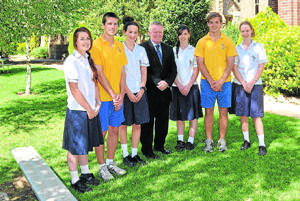 READY TO MAKE THEIR MARK: Hennessy Catholic College year 11 students Caitlin Brown, Tim Hayes, Anna Bewley, Bree Goodlock, Pat Cavanagh and Jayne Curlewis with principal Dr Peter Webster are ready to continue the trend of top marks in the 2012 HSC this year. 