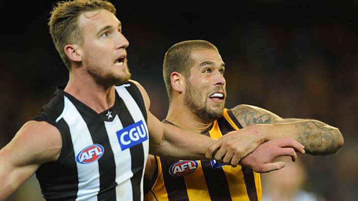 Collingwood's Lachlan Keeffe and Hawthorn's Lance Franklin in a trial of strength at the MCG. Photo: Sebastian Costanzo
