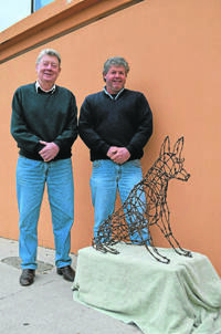 CAVART: Greg Broderick and Steve Cavanagh with Steve's hand-made dog, Rusty, who will be auctioned off to raise money for CanAssist.  