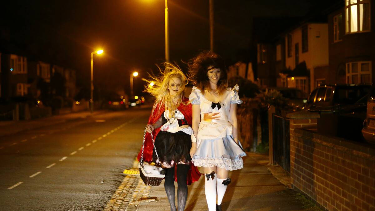 Girls walk to a Halloween party in central England. Photo: REUTERS