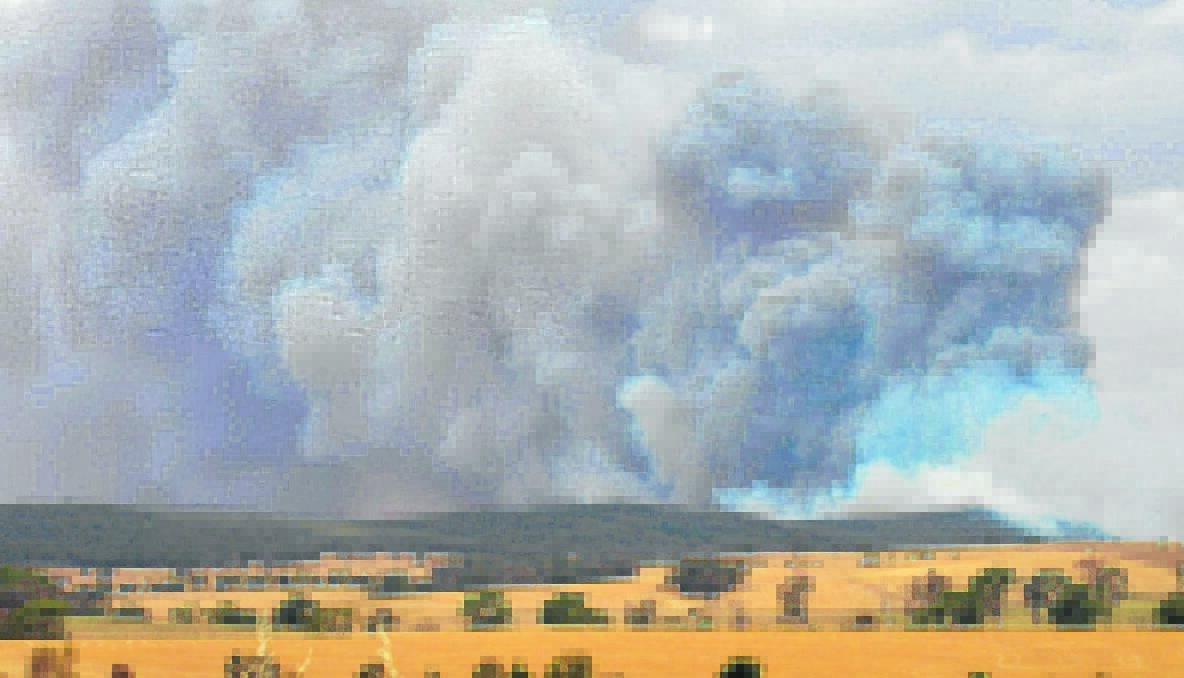 WATERSHED: Smoke billowing from the fire site on Friday afternoon.