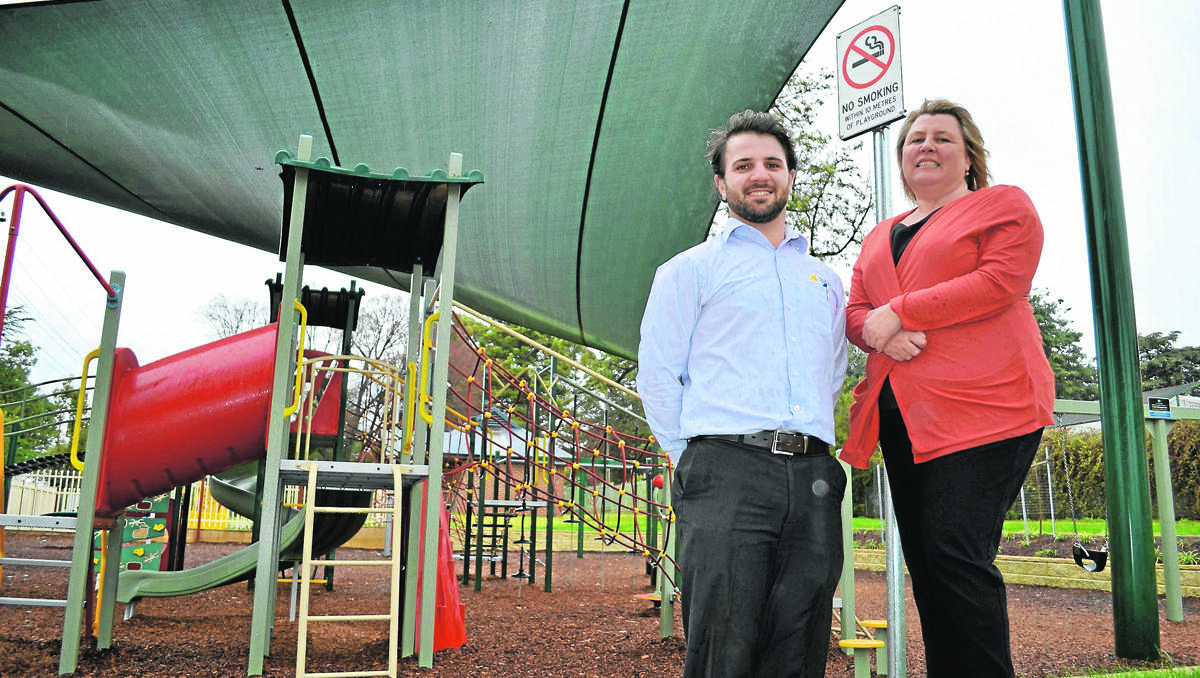 SMOKE FREE: Southern regional manager Toby Dawson and Young’s community and events administrator Debra O’Neil from the Cancer Council check out the new signage installed at the playground in Carrington Park.  
