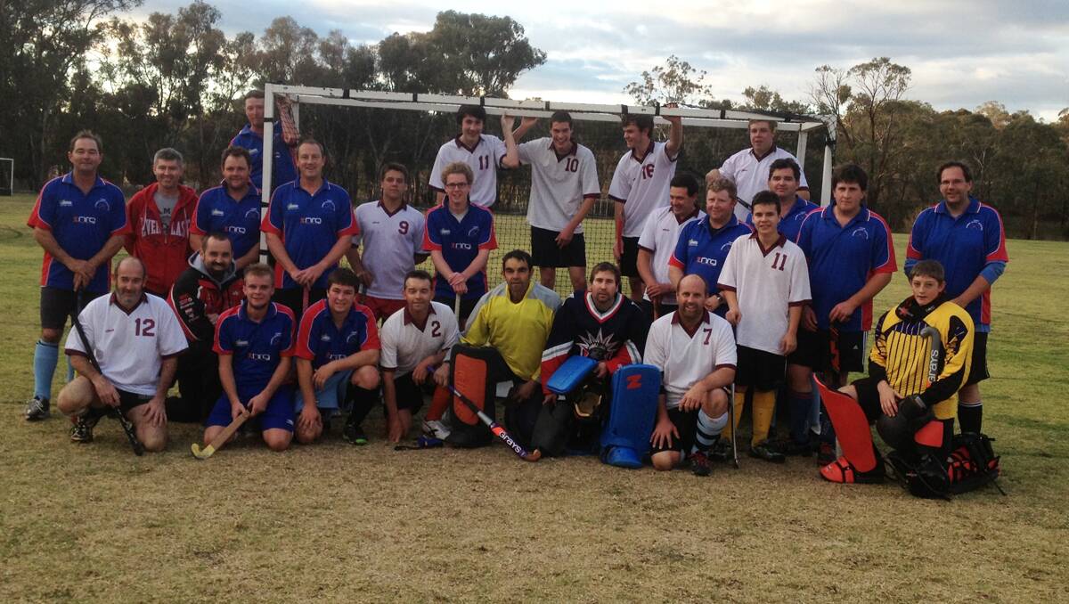 TEAM: Young’s male hockey players in a recent match against Cowra.