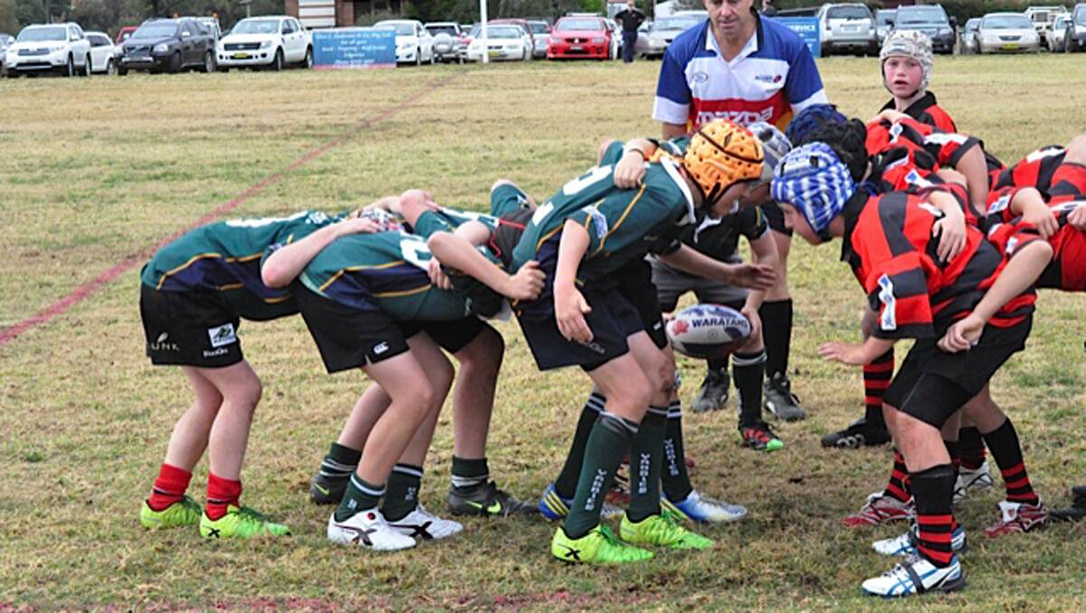SCRUM: Under 13s Young Yabbies going into scrum during their match with Tumut last Sunday. 				(sub)