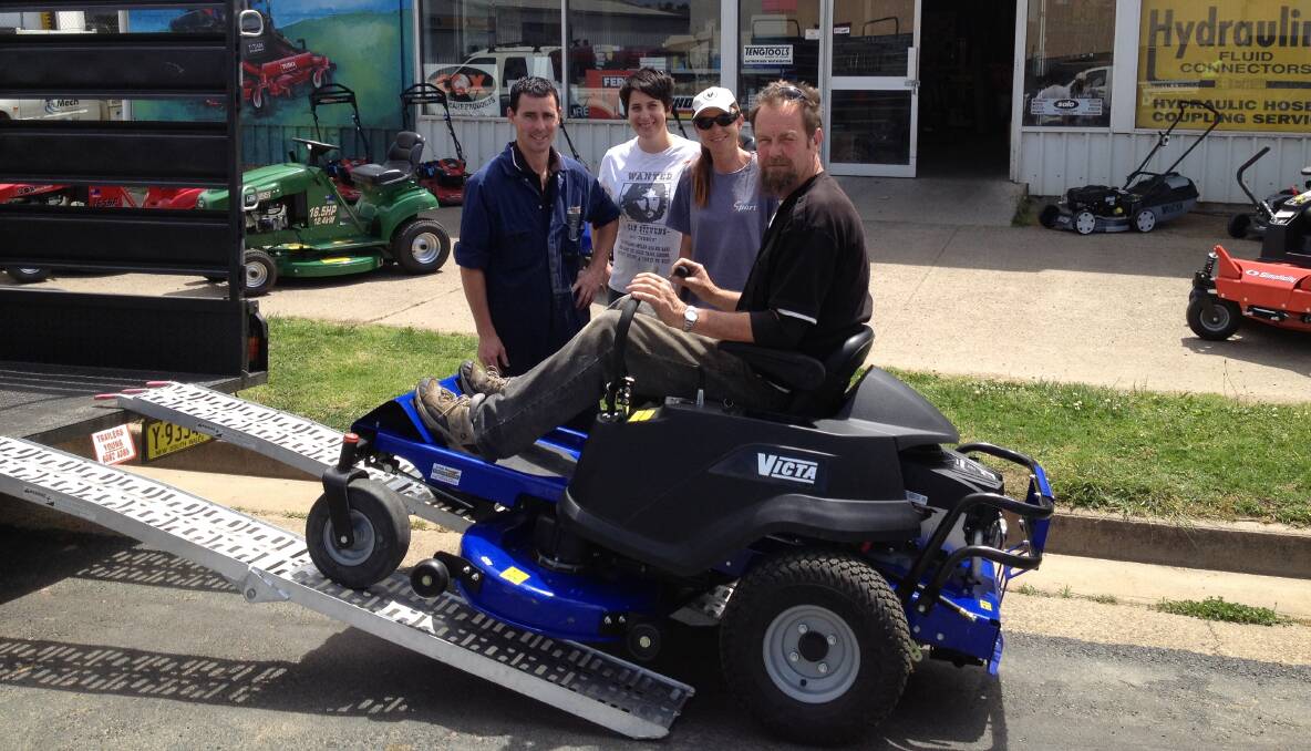 WINNER: Jed and Penny Edwards (right) from Crowther ready to drive away with their new ride-on mower  thanks to Matt Smithers and Kara Simmons from Keith Simmons Engineering.    	            (sub)