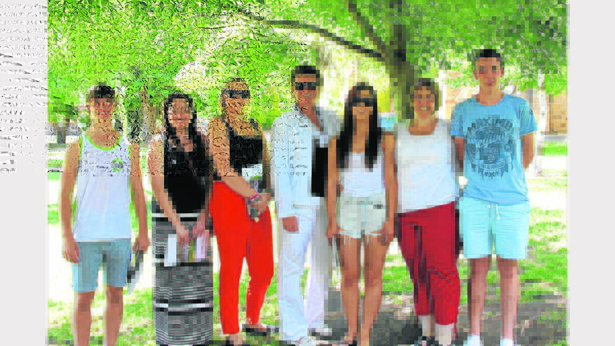 THRILLED: High performing English students from Hennessy Catholic College pictured with staff members on Wednesday after receiving their results.