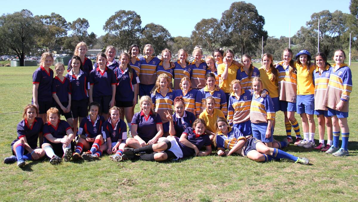 COMPETITION: Young High School and Hennessy AFL girls at Burrangong Oval recently for the inaugural schools AFL gala day. Back, left to right: Young High School’s Freya Steele and Renee Harwick, Hennessy’s Carly Considine, Belle McGrath, Bridget Parkman, Annika Cavanagh, Sophie Cooper, Isabella Graziani, Sara Dawe, Symone Bulmer, Bonnie King, Maddy Anderson, Bridgette Penfold, Nicola Haines-Smith and Claire Hamblin; Middle, left to right: Young High School’s Lauren Reynolds, Isobelle Douglas, Tessa Long, Annabell Jackson and Jemma Long, and Hennessy’s Grace Kaveney, Kate Cusack, Lucy Jones, Claire Cusack, Ashlee Seery; Front, left to right: Young High School’s Sam Estelle, Courtney Foster, Tanika Silk, Kaley Hart, Lizzy Butt and Bailey Pope, and Hennessy’s Tammi Todd, with Young High School’s Lucy Caldow and Hennessy’s Zoe Williams laying at the front. 		         (sub)