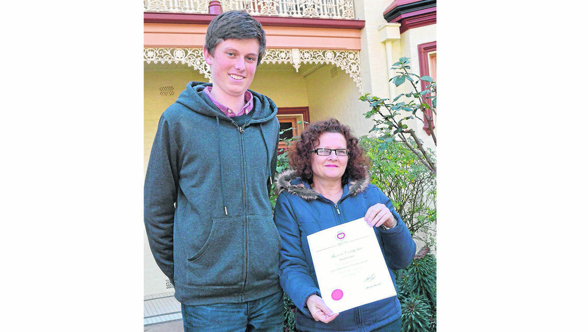 RIGHT: Former Hennessy Catholic College student James Cusack congratulates his former English teacher Pamela Cohen on being nominated for a National Excellence in Teaching Award.       (teachernom003)