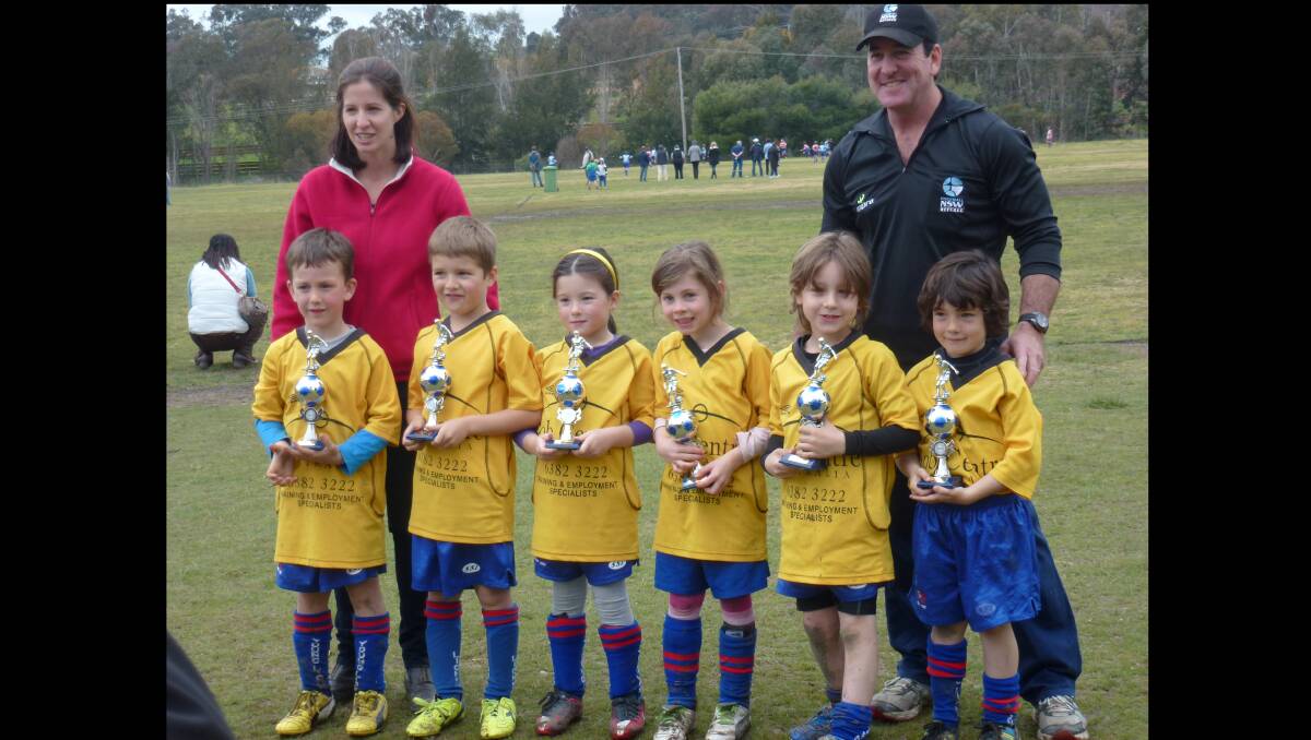 LEFT: Job Centre Australian Under 6 manager Avril Butcher, Paul Cameron Coach Riley Butcher, Max Shea , Annabelle Banwell, Tyler Lacey , Lucas Maloney, Josh Cameron. Job Centre Australia under 6s were very happy getting their trophies.   			              (sub)