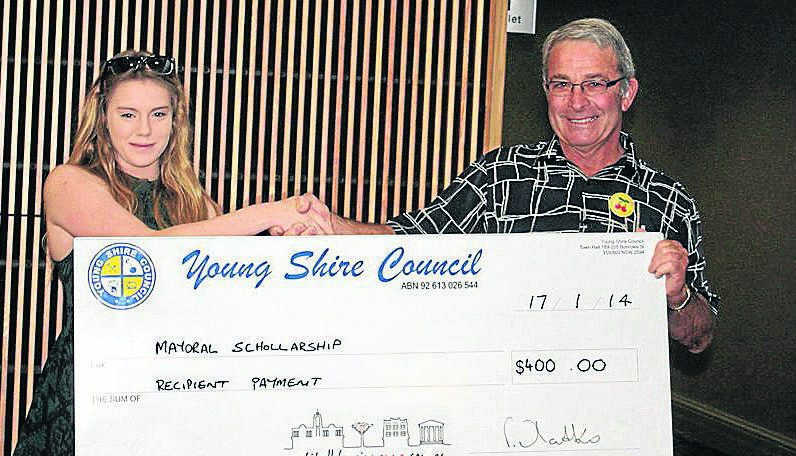 ABOVE LEFT: Sarah Napier happily receives her cheque.     				        (mayoralscholar2)