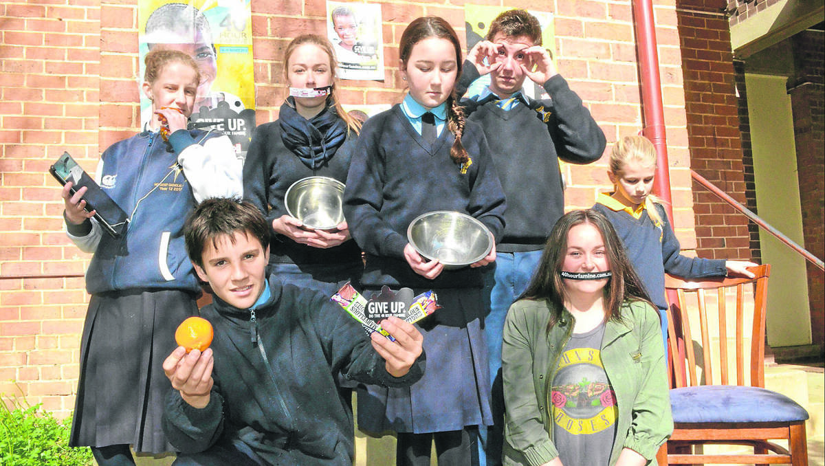 IMPRESSIVE: Hennessy Catholic College students Maddie Rozen, Kai O’Rourke,  Maddi Ryan, Isabella Curtis, Bruce Wayne, Emily Hardy and Abigail are all taking part in this weekend’s 40 Hour Famine, with the funds they raise going towards fighting extreme poverty in Africa.               (40hrfamine005)