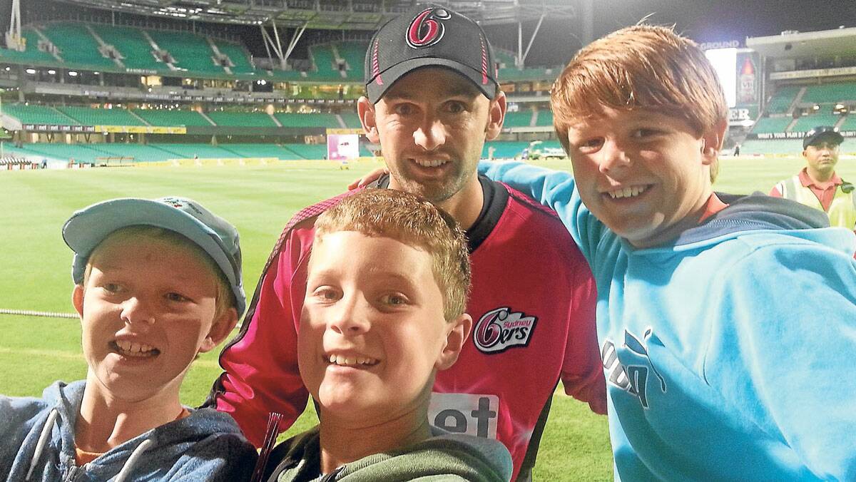 BIG FANS: Darcy Foxall (12), Ben Schofield (10) and Bevan Foxall (10) meeting with Aussie cricket star Nathan Lyon.
