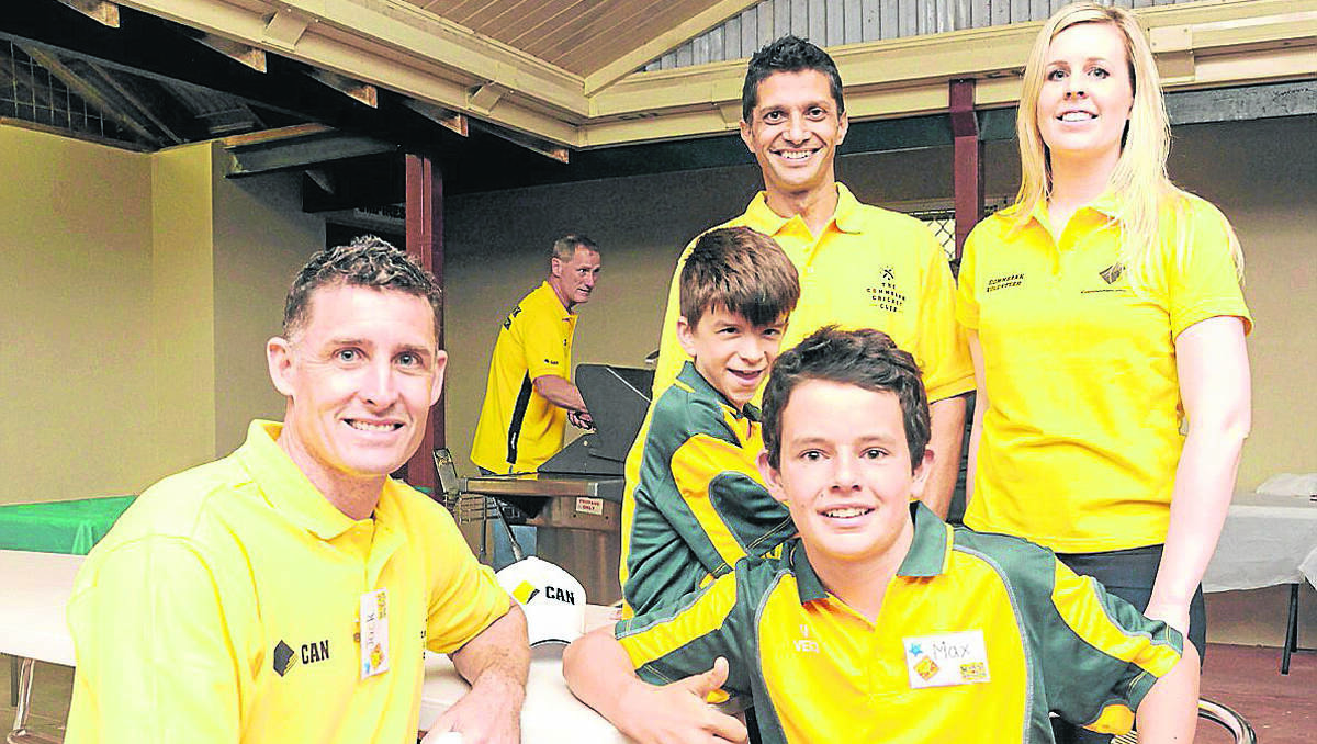 BANK ON CRICKET: CommBank Cricket Club Ambassador Mike Hussey with some keen, young players.