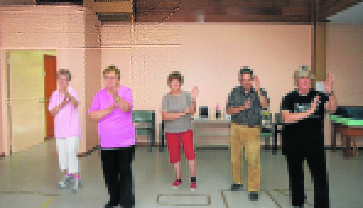TAI CHI: Patty Miller, Jan Bailey, Pat Bell and David Edis with their volunteer Tai Chi leader Rosemary Basham who is helping the elderly and those who have weak legs to be more stable on their feet.