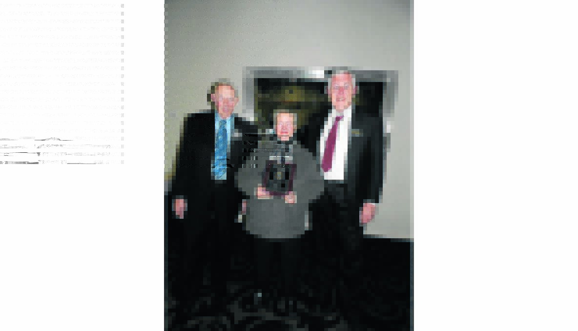 PROUD: Incoming Lions president Rob Hampton pictured with Citizen of the Year award recipient Gail Butt and outgoing Lions president David Tame.
