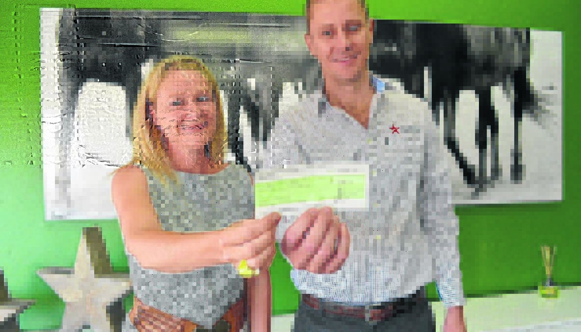 SUCCESSFUL SEASON: Young Crisis Accommodation Centre’s Zoe Nott gratefull accepts a $1000 cheque from Burrangong Picnic Race Club (BPRC) president Anthony Murphy following a successful picnic races.