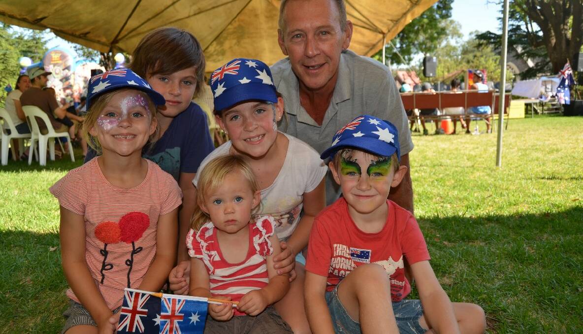 FAMILY: People of all ages headed down to Carrington Park on Saturday for Australia, including (from left to right) Anna (6) and Campbell Harden (10), Jorja Gibson (2), Brydee Harden (8), Neil Wilkes and Archie Gibson (4).