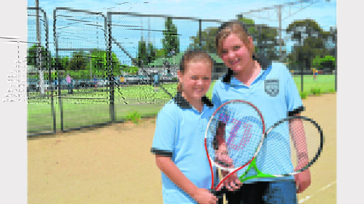 FRIENDS: Chloe West and Erica Weekely of Koorawatha at the Small Schools Tennis Championships.