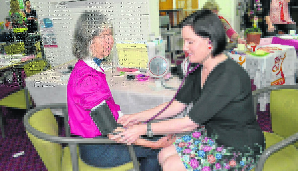 CHECK –UP: Penny Gibson getting her blood pressure tested by registered nurse Trish Grainger of the Boorowa Street practice.