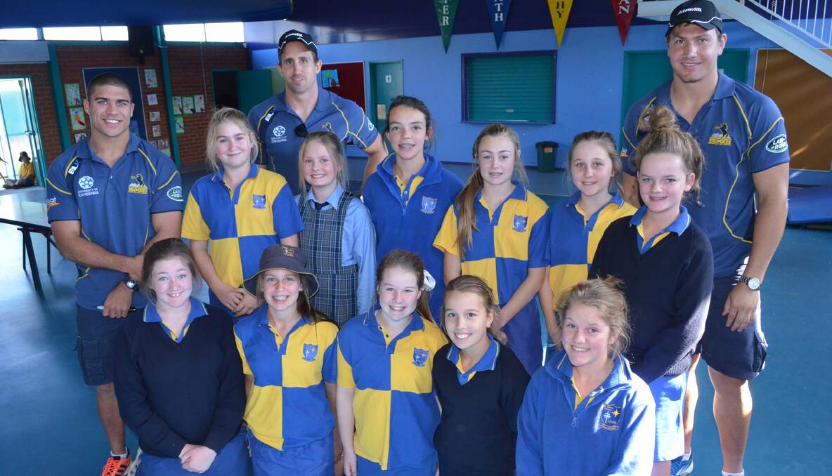 BRUMBIES: St Mary’s Primary School students Chelsea Gibson, Brooke Hunter, Ashleigh Brown, Paris Mohr, Maggie O’Connor, Annie Wark, Annabelle Hudson, Mackenzie Brownlie, Rachael Smyth, Elouise Curry and Prue Edgerton enjoyed a visit from three members of the Brumbies squad earlier this month, Mark Swanpoel, Andrew Smith and Etienne Oosthuizen.