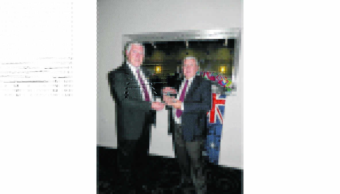 RECOGNITION: Outgoing Lions president David Tame with Stuart Maxwell who represented the Young Harness Racing Club.  
