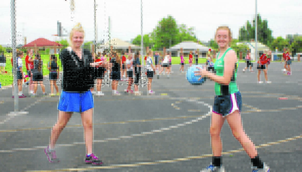EXCITED: 16-year-old Micaela Hall (left) and 14-year-old Olivia Gay of the Young District Netball Association - who took part in the recent representative netball trials at the Young PCYC - have also been selected to play in the Southern Sports Academy netball squad, which will see them partake in a series of training sessions and academy games over the year.	