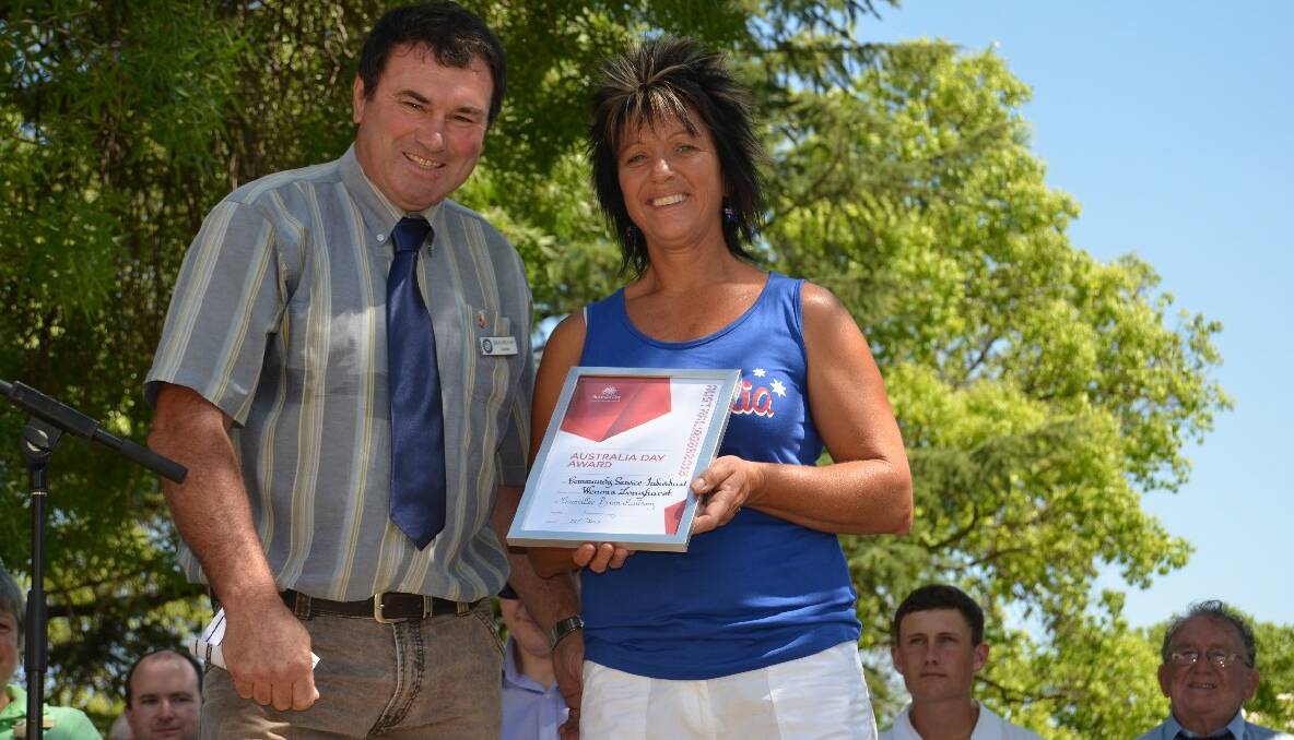 RECOGNISED: Councillor Brian Mullany presented volunteer junior rugby league coach Wenona Longhurst the Community Service - Individual award at the Australia Day ceremony in Carrington Park on Saturday.