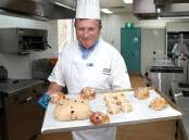 TREATS: Chocolatier Herve Boutin prepares hot cross buns for a cooking tutorial, available on the Daily Advertiser website. Picture: Les Smith