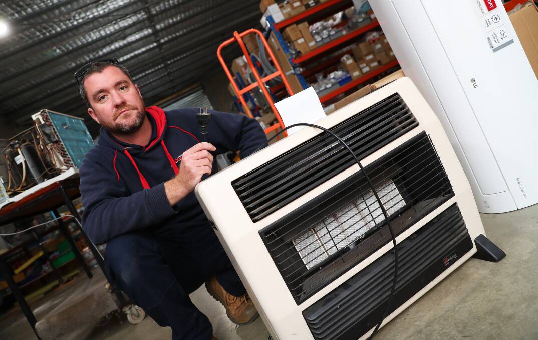STAY SAFE: Repairman Adam Oliver is urging residents to stay safe and not use heaters picked up from the roadside. Picture: Emma Hillier