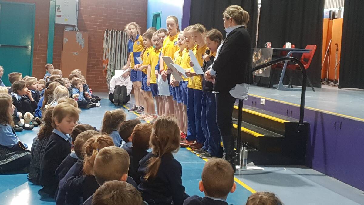 INSPIRATIONAL: Students from St Mary's Primary School shared with their fellow peers information about influential Aboriginal and Torres Strait Islander women as part of their NAIDOC Week celebrations.