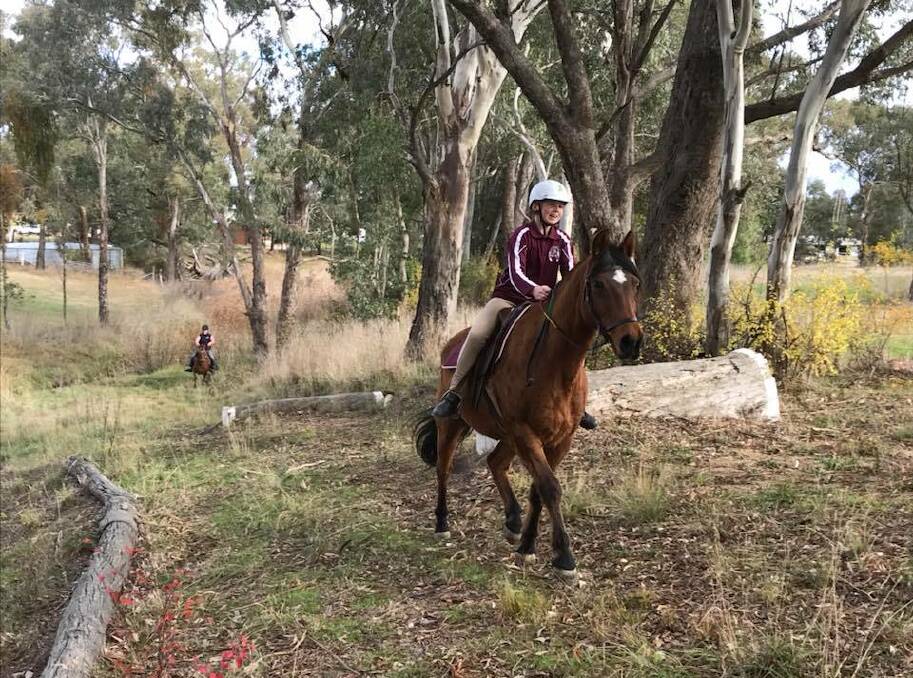 JUMPING FOR JOY: Jess Mcrae and Banjo enjoying themselves on the cross country course at the last Young Pony Club rally day. 