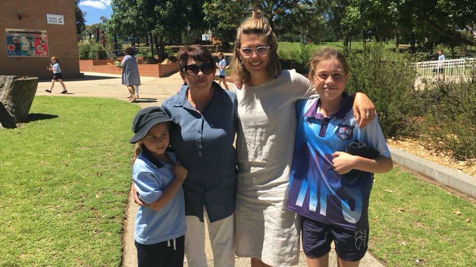 WHAT A DAY: Mrs Ferguson with her grand-daughters Lara, Elle and Sophia at Young North Public School. Photo: Kel Smerdon.