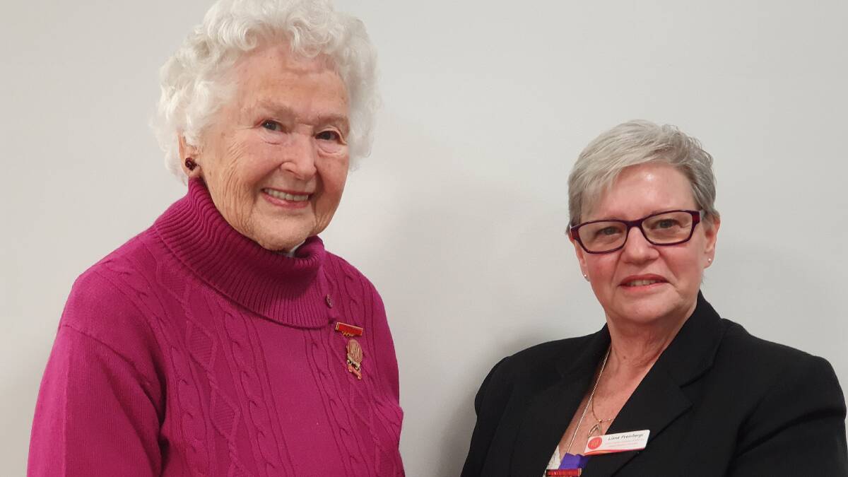 Nancy McGregor being presented with her 20 year service bar. Photo: Supplied