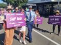 Local police, Mayor Margaret Roles and Deputy Mayor Alison Foreman joined locals marching against family and domestic violence.