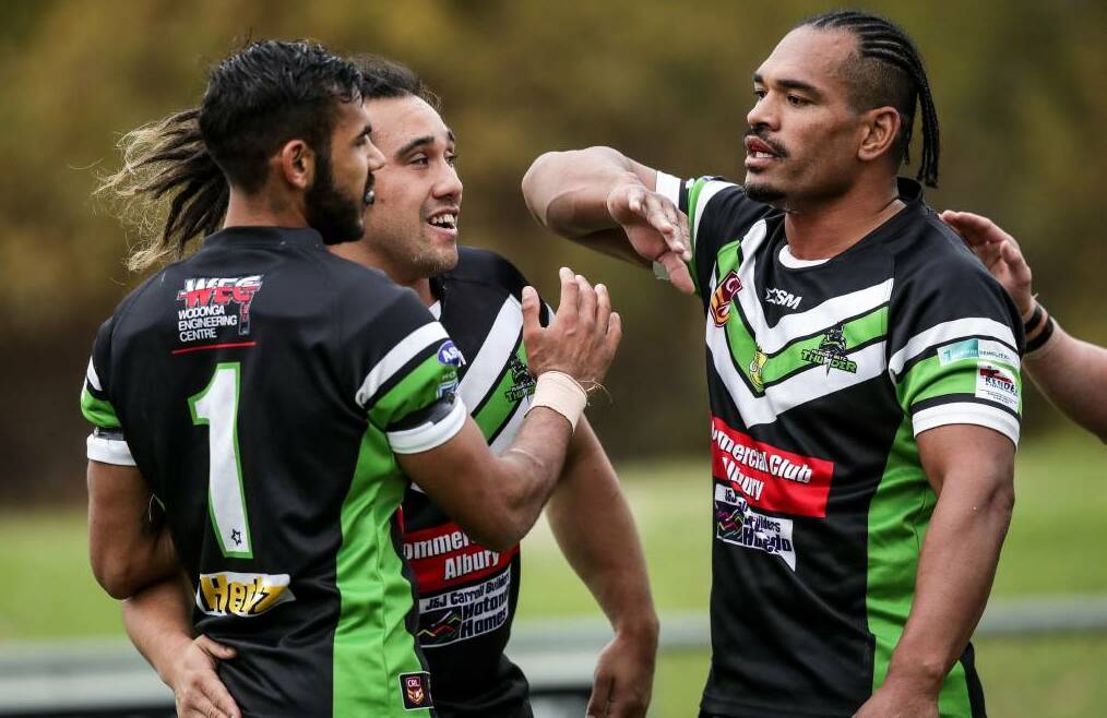 TRY TIME: Keanu Wighton is congratulated by teammates Shannon Rupapere and Etu Uaisele after scoring a try. Picture: James Wiltshire.