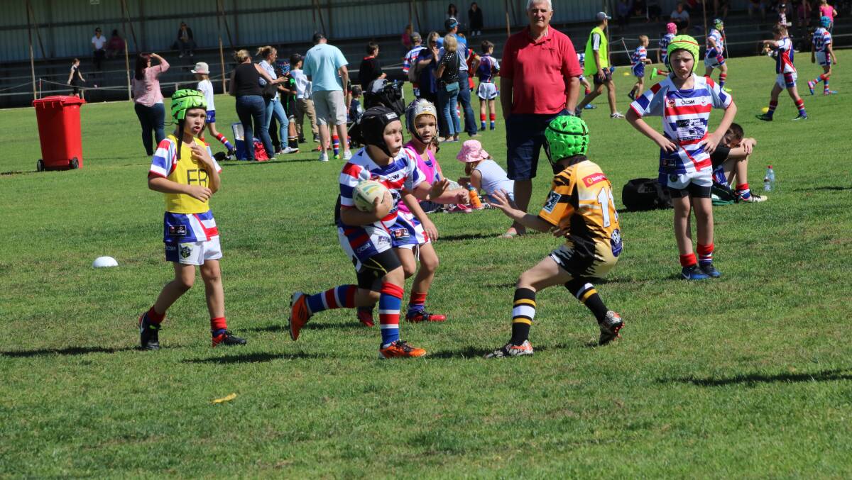Shaun McAlister takes on the competition during the Under 9's game.